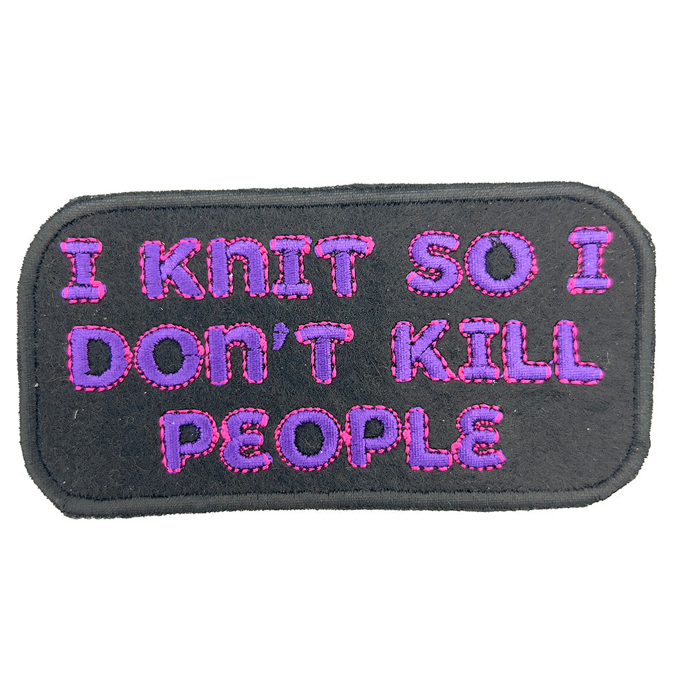 Close-up view of an embroidered felt patch with the text "I KNIT SO I DON'T KILL PEOPLE" in pink and purple letters on a black background.