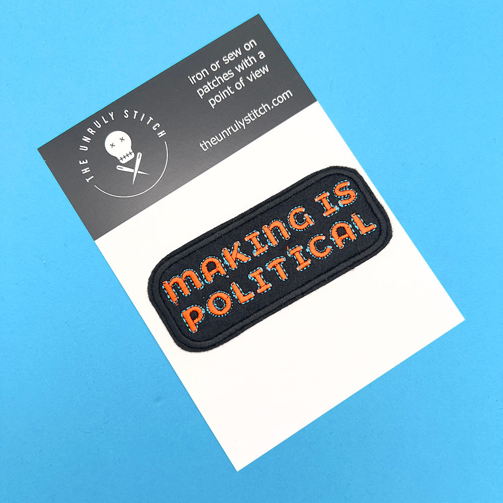 Patch on card: The same "Making is Political" embroidered felt patch attached to a card. The card has "The Unruly Stitch" logo and website, with the text "Iron or sew on patches with a point of view" printed on it.