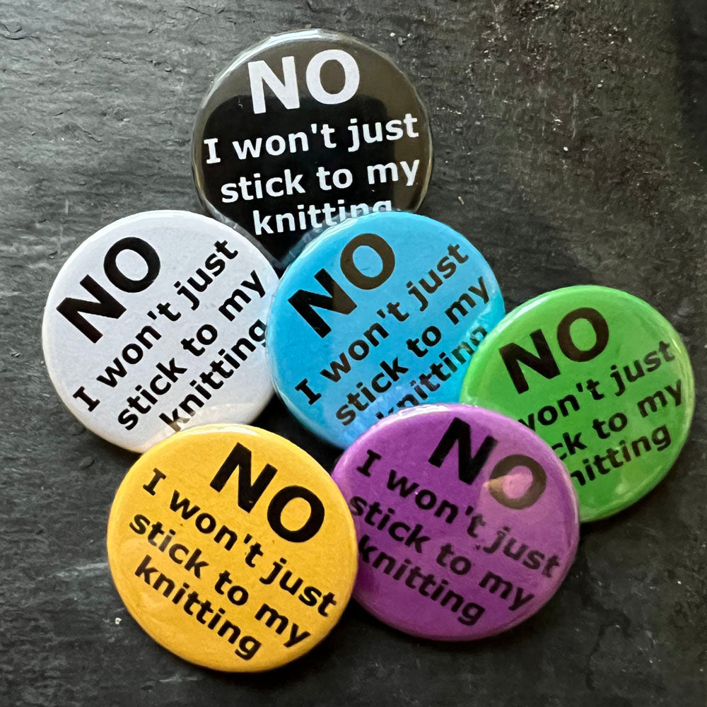 Six NO I won't stick to my knitting pin badges in black, blue, pink, green, yellow, and white.
