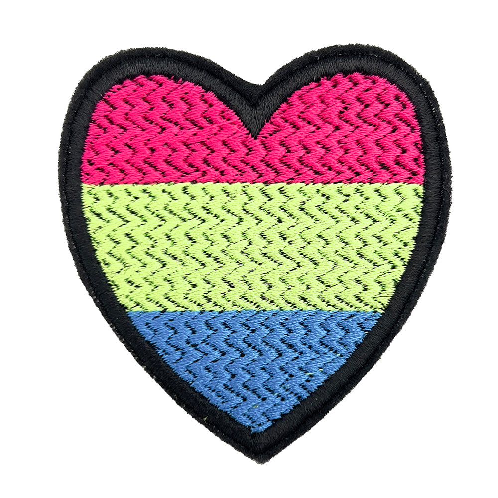 Close-up of a heart-shaped embroidered felt patch with the polysexual pride flag colors (pink, lime, and blue) on a white background.