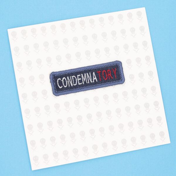 gift card with blue denim patch embroidered with the word CONDEMNATORY