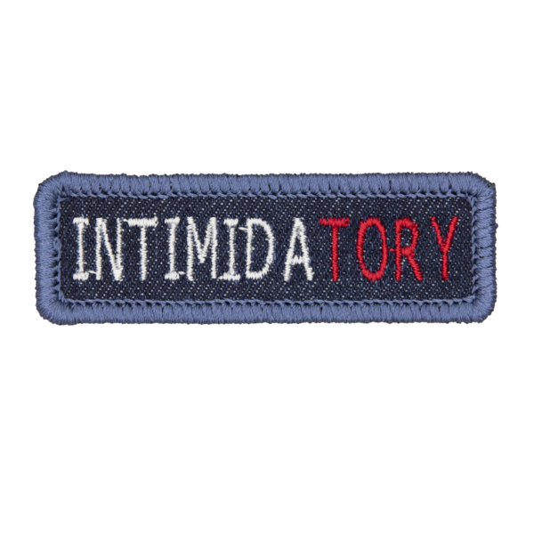 blue denim patch embroidered with the word INTIMIDATORY