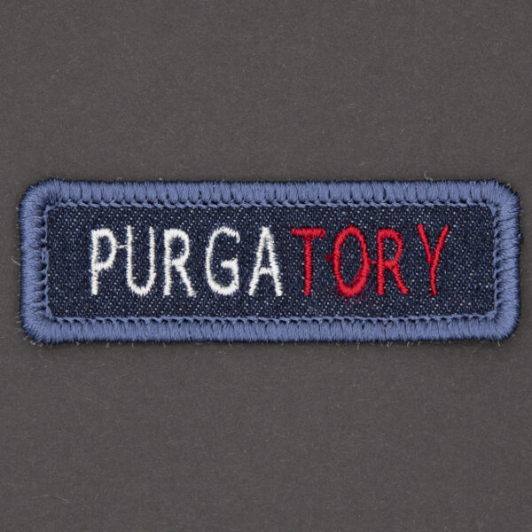 blue denim patch embroidered with the word PURGATORY