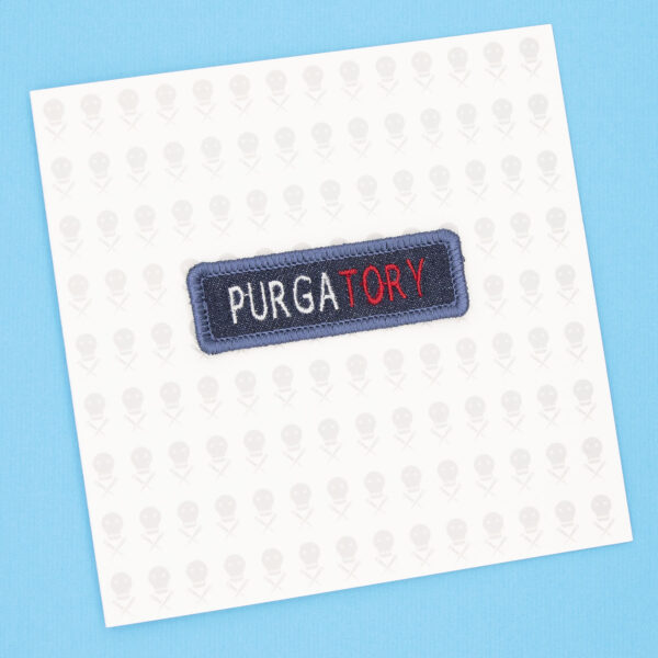 gift card and blue denim patch embroidered with the word PURGATORY