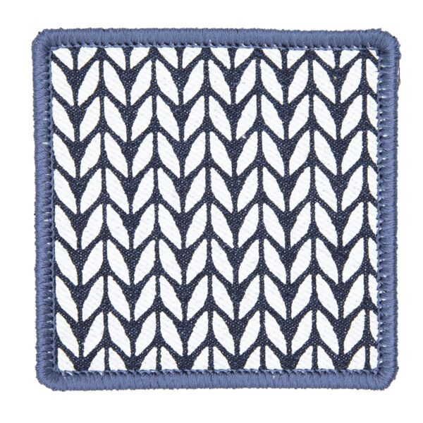 patch made from blue denim screen printed with a stocking stitch print and finished with an embroidered border