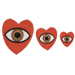 three embroidered patches, all read hearts with brown eye in the centre. Patches are large, medium and small. Displayed in a horizontal line on a white background.