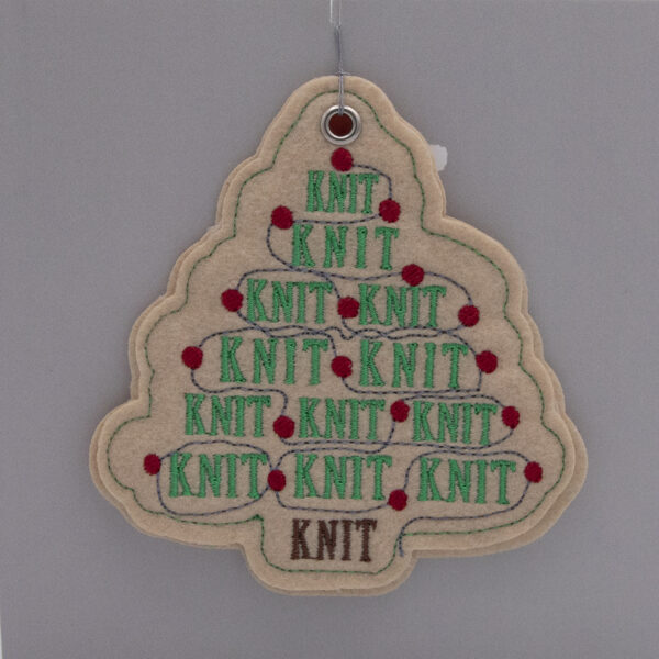cream felt ornament, Christmas tree shape embroidered with KNIT, KNIT, KNIT in green and red fairy lights