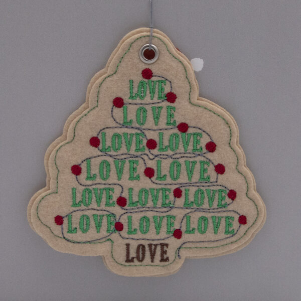 cream felt ornament, Christmas tree shape embroidered with LOVE, LOVE, LOVE in green and red fairy lights