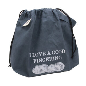 bag with drawstrings closed. large slate blue drawstring project bag. The bag is printed with text "I LOVE A GOOD FINFERING" and a skein of yarn in white ink. The bag has a handle, a drawstring and a cream label with The Unruly Stitch logo