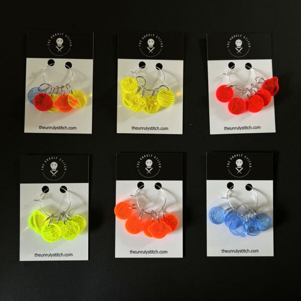 Business cards for The Unruly Stitch, each with a set of five planet stitch markers.