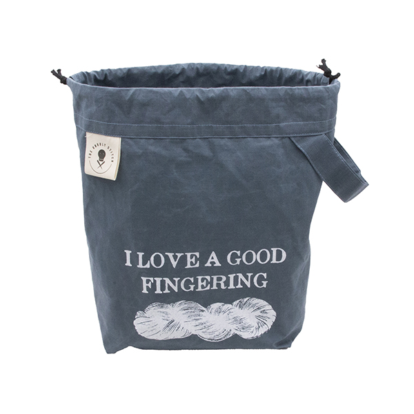 small slate blue drawstring project bag. The bag is printed with text "I LOVE A GOOD FINFERING" and a skein of yarn in white ink. The bag has a handle, a drawstring and a cream label with The Unruly Stitch logo