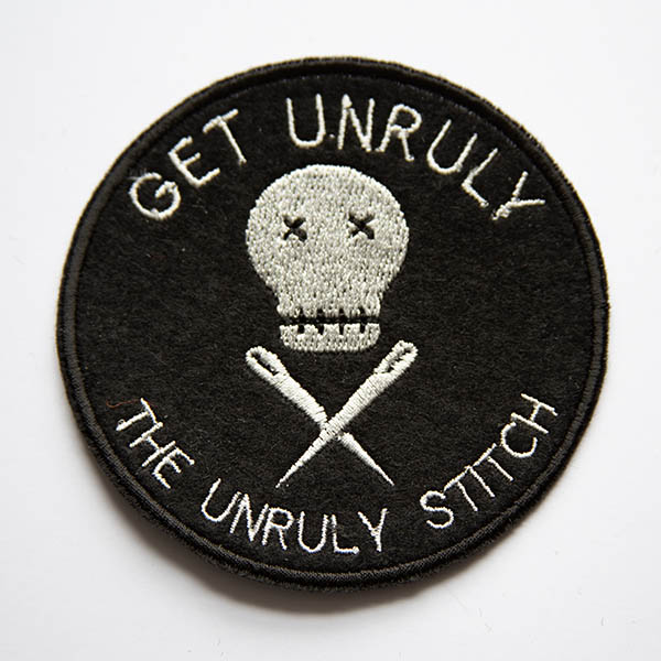 Get unruly the unruly stitch logo embroidered patch in silver on black felt.
