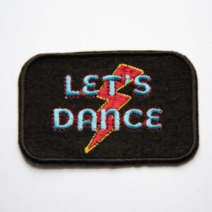 Lets dance in turquoise and red lightening bolt embroidered patch on black felt.