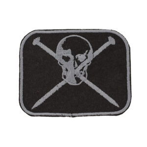 Embroidered patch showing a skull and crossed knitting pins on black felt on white background